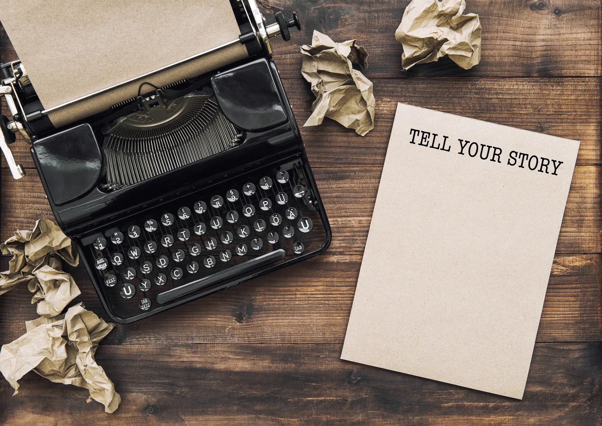 Antique typewriter and paper notebook. Tell Your Story. Creativity concept