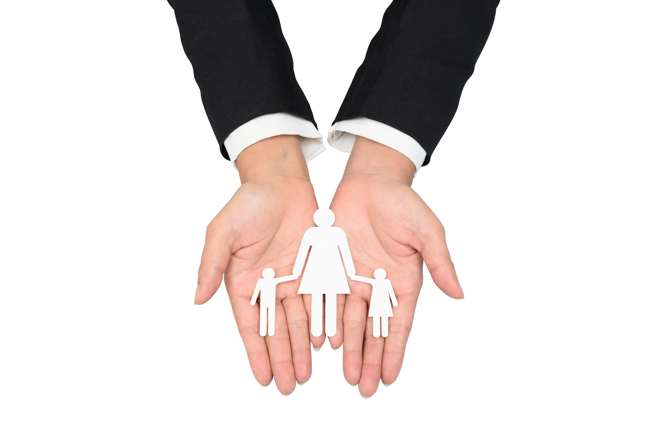 people, charity and care concept - close up of business woman hands holding paper family. isolated on white background with clipping path